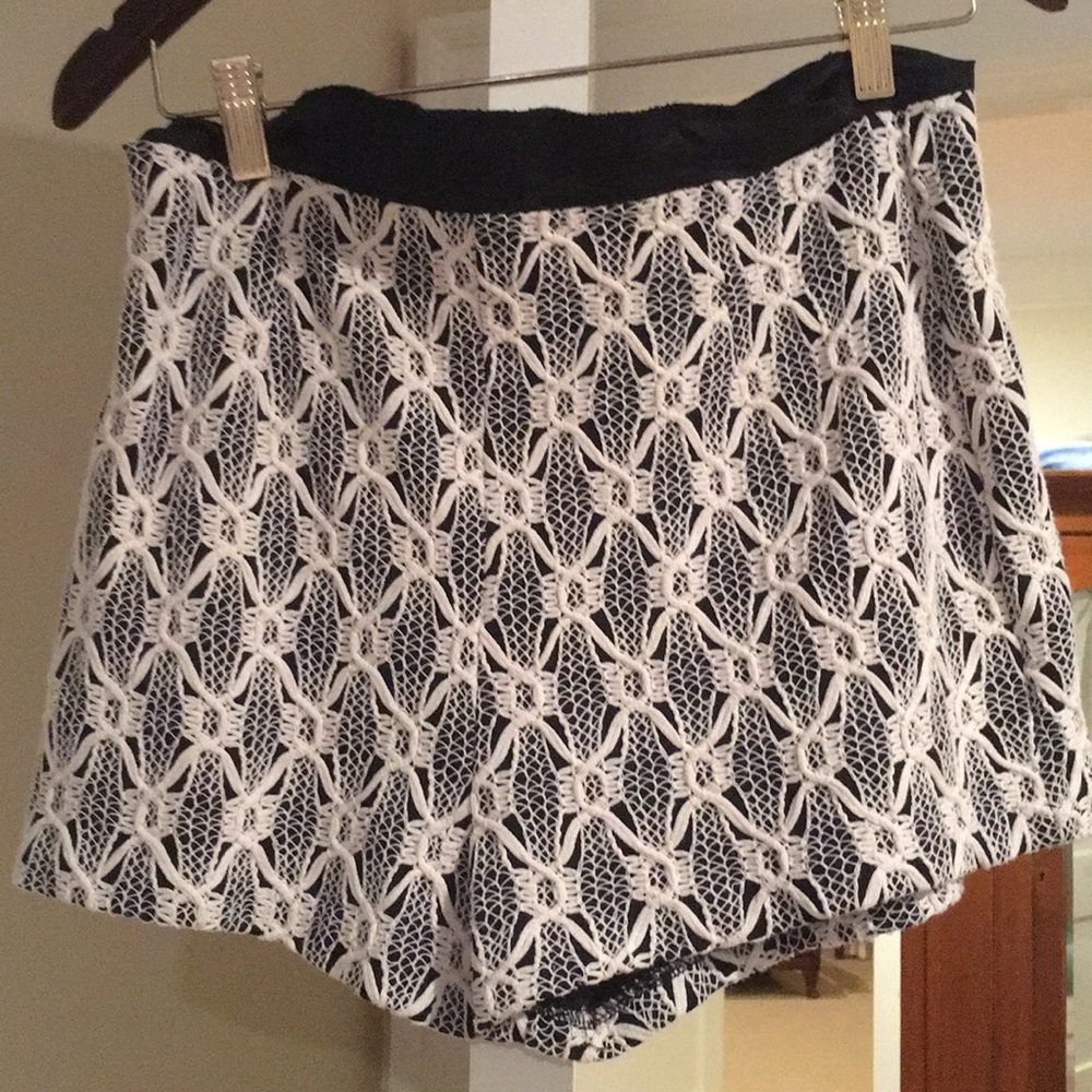 White lace shirts with black background.